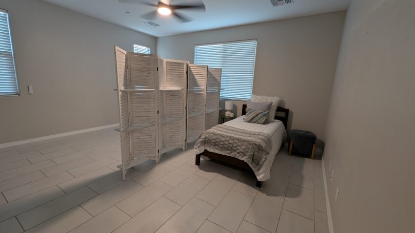 Large semi-private suite with privacy screen at Desert Willow Memory Care.
